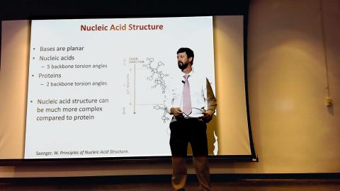 Dr. Chris Johnson presents a lecture on DNA properties.